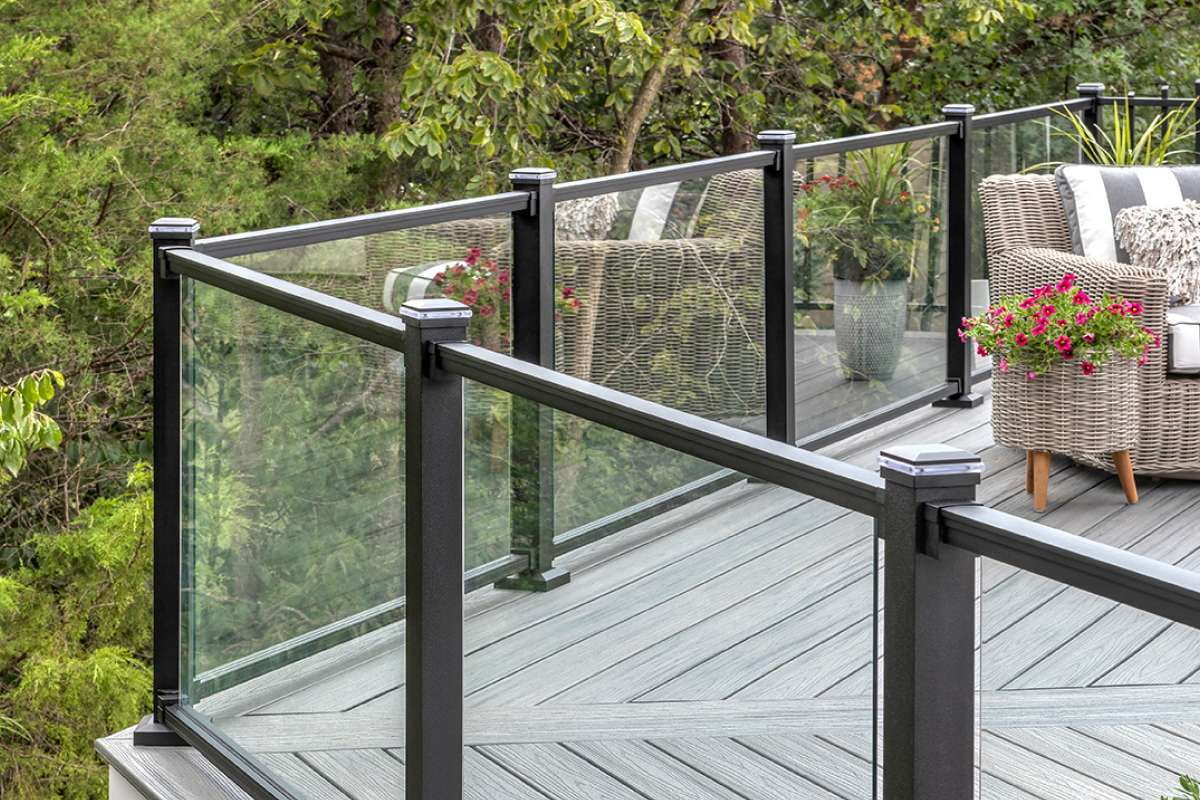 a deck with aluminium glass railings